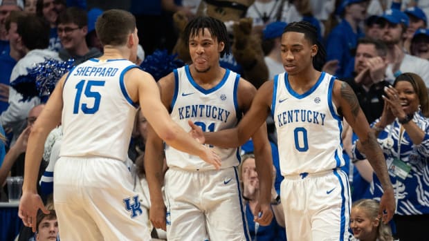 Kentucky Wildcats guard Reed Sheppard (15) celebrates with guard Rob Dillingham (0) after a play during their game against the Arkansas Razorbacks on Saturday, March 2, 2024 at Rupp Arena.